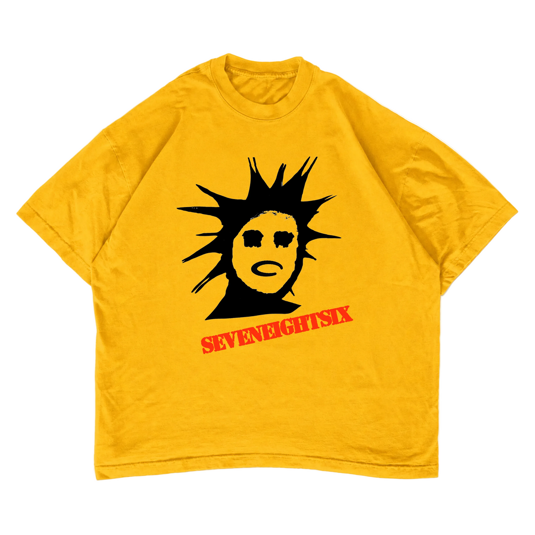 Yellow t-shirt with black and red graphic design "SEVEN EIGHT SIX" on a white background